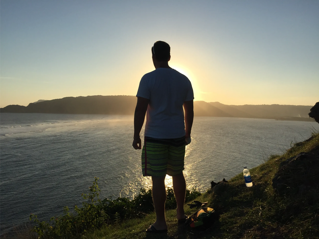 Standing on a cliff looking out at the ocean